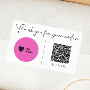 May include: A rectangular white sticker featuring the black text Thank you for your order at the top. On the left is a solid pink circle with a black heart and the text OH BEAU! On the right is a black and white QR code with the text SCAN ME! below.