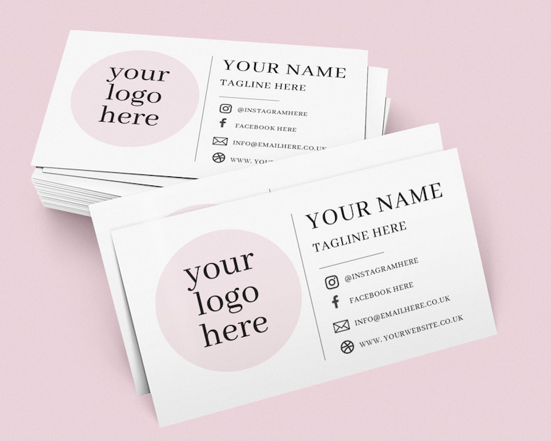 May include: A stack of white business cards with a pink circle containing the text "your logo here". The cards also include the text "YOUR NAME TAGLINE HERE" and contact information including a website, email address, and social media handles.