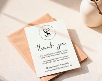 May include: A white rectangular thank you card with black text and a circular logo featuring the letters TS. The card includes the message: Thank you, Our small business wouldn't be the same without customers like you! Please tag us in your pictures on social media, and leave us a review. It also lists @taylorsmith_handmade and www.taylorsmithhandmade.co.uk.