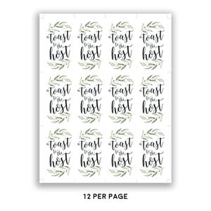May include: A sheet of twelve rectangular labels arranged in a grid, each featuring the black text "a toast to the host" in a script font, framed by a green watercolour olive branch wreath. The bottom of the sheet displays the text "12 PER PAGE".