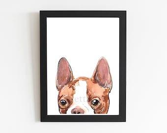 May include: Framed watercolor print of a dog's face, featuring brown and white fur, large brown eyes, and upright ears. The artwork is set against a white background within a black frame, creating a clean and modern aesthetic.
