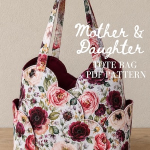 May include: A tote bag featuring a floral pattern with red, pink, and white peonies and green leaves on a white background. The bag has a scalloped edge design and a deep red interior lining. The text "Mother & Daughter TOTE BAG PDF PATTERN" is visible.