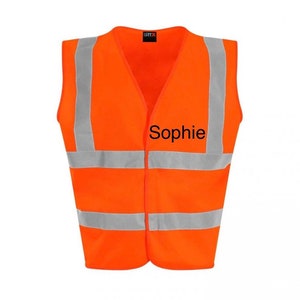 May include: Orange safety vest with reflective strips and the name "Sophie" embroidered on the front.