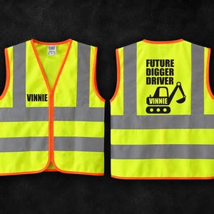 May include: A neon yellow high-visibility safety vest with orange trim, featuring reflective silver horizontal stripes. The front displays the name VINNIE, while the back shows an excavator graphic with the text FUTURE DIGGER DRIVER VINNIE.