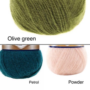 May include: Three balls of yarn in different colours: olive green, teal blue, and light pink. The yarn is soft and fluffy, and it is perfect for knitting or crocheting.