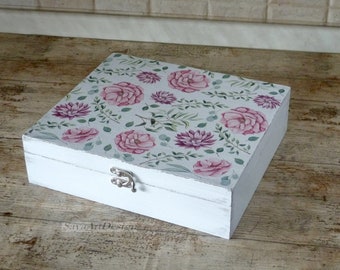 Wooden tea box decorated with flowers and branches. Tea bags storage box.