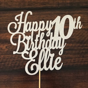 May include: Silver glitter cake topper with the text "Happy 10th Birthday Ellie".