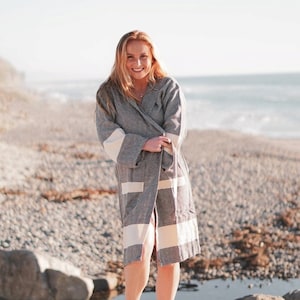 100% Cotton, hand made light weight bathrobe. It has pockets and hood. Comes in black, grey, blue, red, beige, turquoise, dark green and purple.