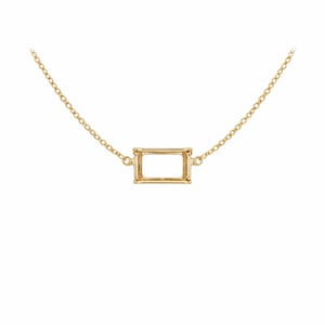 May include: A gold necklace featuring a rectangular pendant. The pendant has a frame design, and the chain is delicate. The necklace is set against a white background.
