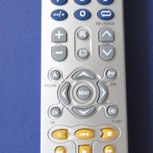 May include: A set of three ceramic mugs with a speckled, matte finish. The mugs are in shades of cream, light gray, and dark gray. Each mug has a simple, minimalist design and a rounded handle. The mugs are stacked on top of each other.