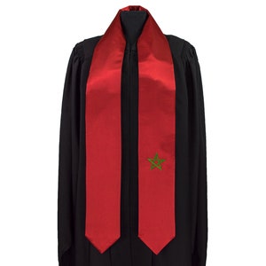 May include: Red graduation stole with a green five-pointed star in the centre.