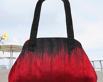 Bolso de mano de seda hecho a mano: elegante bolso con forma trapezoidal en degradado rojo y negro.