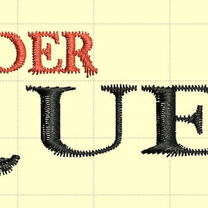 May include: Embroidered text reads "ALEXANDER MCQUEEN". The word "ALEXANDER" is in red thread, while "MCQUEEN" is in black thread. The letters are in a serif font, with the "Q" having a unique swirl design.