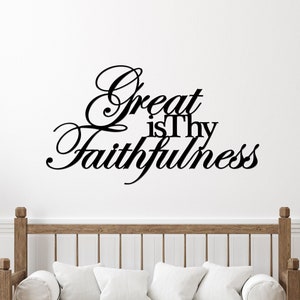 The words Great is Thy Faithfulness are displayed in two different fonts and connected together to hang as a single piece.  Great and Faithfulness are in a highly scripted font with the first letter capitalized.  Other words are in a printed font.