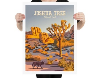 May include: A colorful illustration of Joshua Tree National Park in California. The image features a large Joshua Tree, rocky hills, and a coyote in the foreground. The text "Joshua Tree National Park" is displayed at the top of the image.