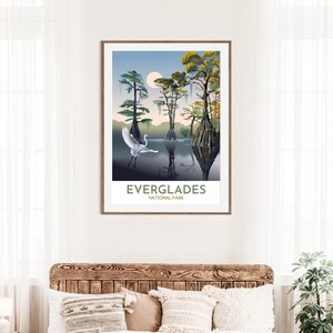May include: A poster with a stylized illustration of a white egret flying over a swamp with cypress trees. The text "Everglades National Park" is at the bottom of the poster.