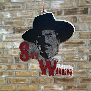 May include: A set of three ceramic mugs with a speckled, matte finish. The mugs are in shades of cream, light brown, and dark brown. Each mug has a simple, minimalist design, perfect for coffee or tea.