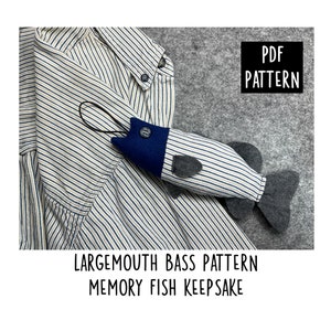 May include: A PDF pattern for a largemouth bass memory fish keepsake. The pattern is for a blue and gray felt fish with a striped body.