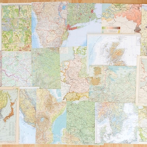 May include: A collection of vintage maps, each depicting a different region of the world. The maps are printed on paper and have a worn, aged look. They are arranged in a grid pattern on a wooden surface.