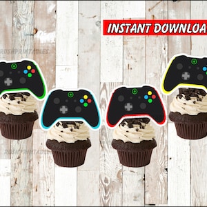 May include: Four printable cupcake toppers featuring a black and green video game controller with colorful buttons. The toppers are perfect for a video game themed party.