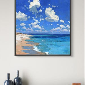 May include: A framed painting depicts a vibrant beach scene. The artwork showcases a bright blue sky dotted with fluffy white clouds. Turquoise water meets a sandy shore, creating a serene coastal landscape. Two dark blue vases sit below the painting.