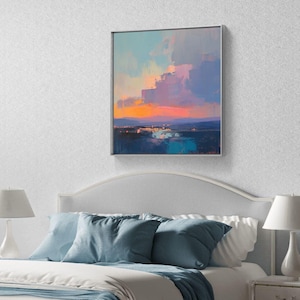 May include: A framed abstract painting depicting a sunset over a body of water. The painting features a vibrant pink and orange sky with blue and green water in the foreground.
