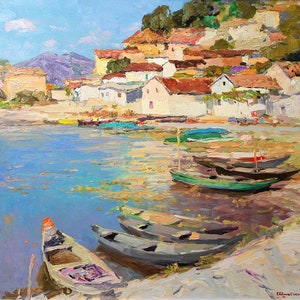 May include: A painting of a small village on a waterfront with several boats docked. The village is built on a hillside with white buildings and red tile roofs. The water is a light blue color and the sky is a clear blue.