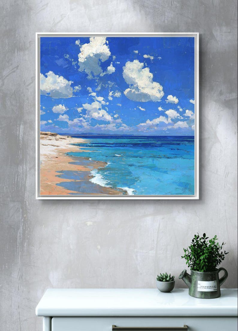 May include: A framed painting of a beach scene. The artwork depicts a bright blue sky filled with fluffy white clouds. The ocean transitions from turquoise to deep blue, meeting a sandy beach.
