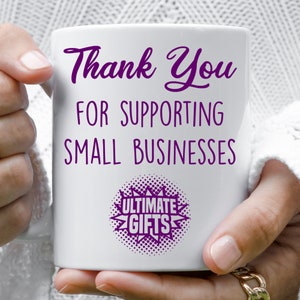 May include: White ceramic mug with purple text that reads "Thank You for Supporting Small Businesses" and a purple starburst with the text "Ultimate Gifts".