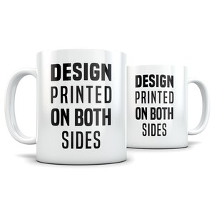 May include: White ceramic mug with black text that reads "DESIGN PRINTED ON BOTH SIDES". The mug is shown from the side and the text is visible on both sides of the mug.