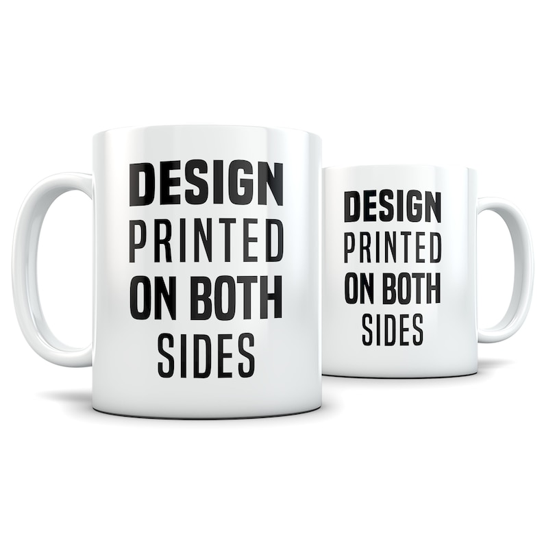May include: White ceramic mug with black text that reads "DESIGN PRINTED ON BOTH SIDES". The mug is shown from the side and the text is visible on both sides of the mug.