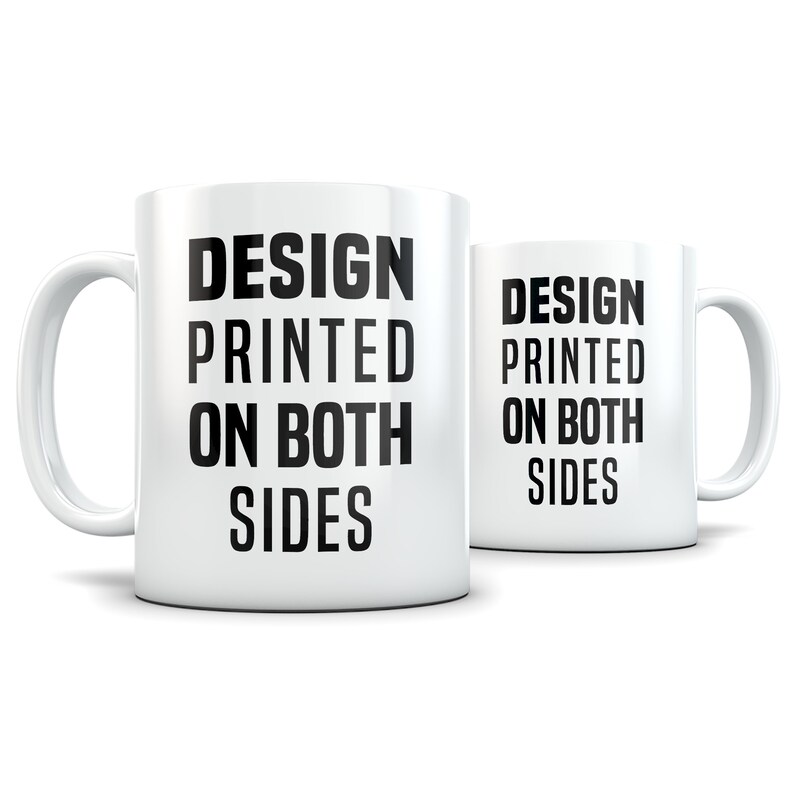 May include: White ceramic mug with black text that reads "DESIGN PRINTED ON BOTH SIDES". The mug is shown from the side and the text is visible on both sides of the mug.