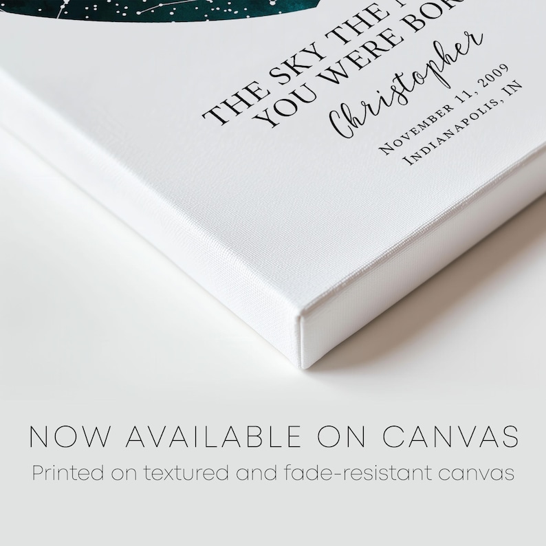 a white book with a green leaf on it
