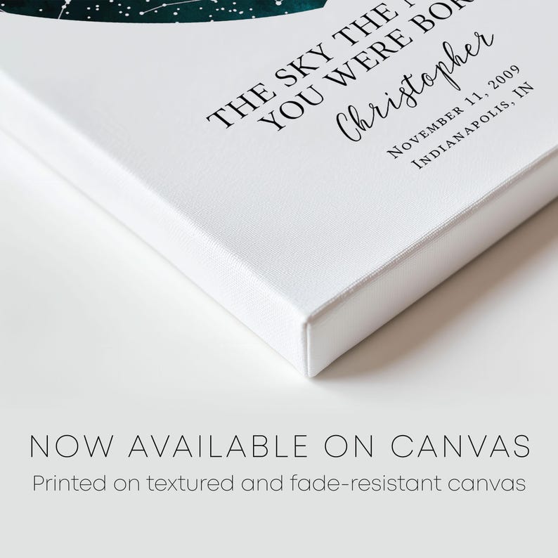 a white book with a green leaf on it