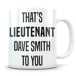 May include: White ceramic coffee mug with black text that reads "That's Lieutenant Dave Smith to you."
