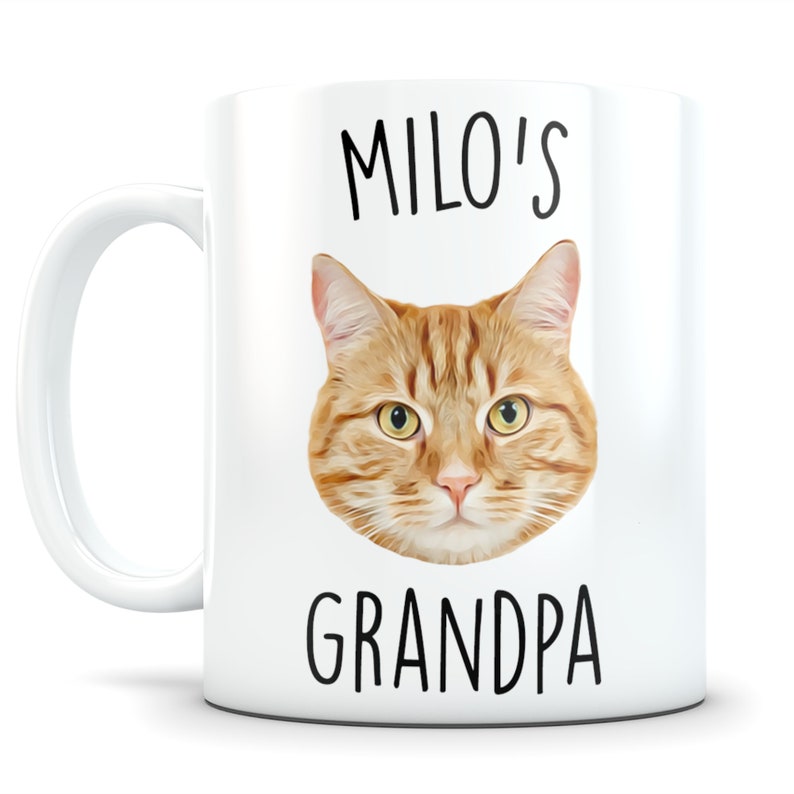 May include: White ceramic mug with a picture of a ginger cat and the text "Milo's Grandpa" printed on it.