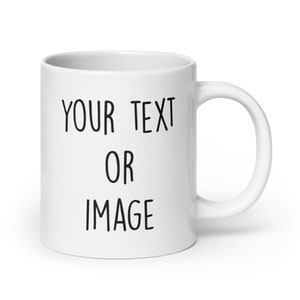 White blank coffee mug mock set-up, outside on a little wooden table with  an ironwork