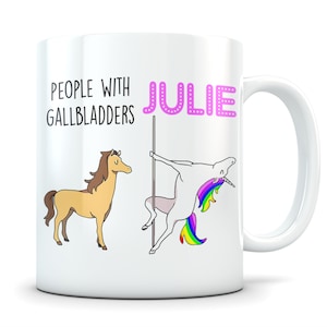 May include: White ceramic mug with a pink unicorn and a brown horse illustration. The text "People with Gallbladders" and "Julie" is printed on the mug.