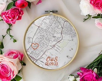May include: A gold-framed embroidery hoop with a map of Jersey City, New Jersey. A heart is marked on the map with the initials "O & S" and the date "01.09.23" written below.