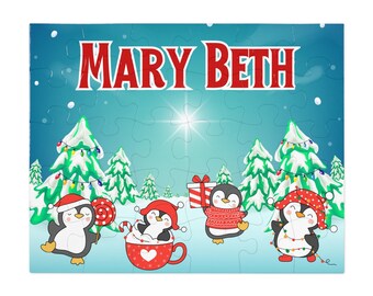 May include: A personalised jigsaw puzzle with the name "MARY BETH" in red. The puzzle depicts a winter scene with cartoon penguins wearing Santa hats and holding gifts, candy canes, and Christmas lights. Snow-covered trees are in the background.