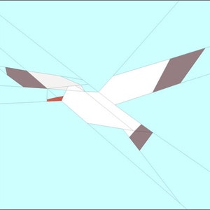 May include: A white paper seagull with gray wing tips flying against a light blue background. The seagull has a red beak.