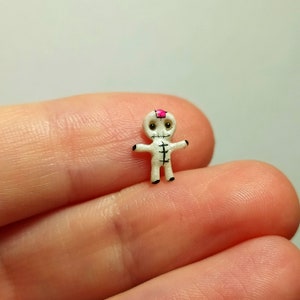 Cute and flat irridescent white color voodoo doll without pins figurine.