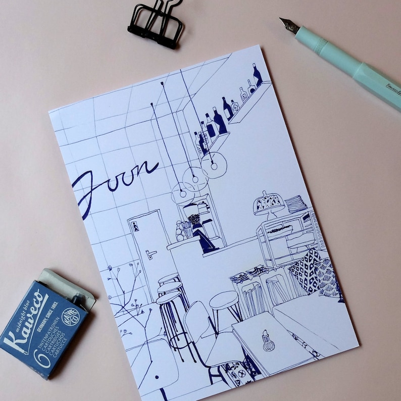 May include: A blue and white line drawing of a cafe interior with the word "Joon" written in large letters. The drawing includes tables, chairs, and a bar with bottles on shelves.
