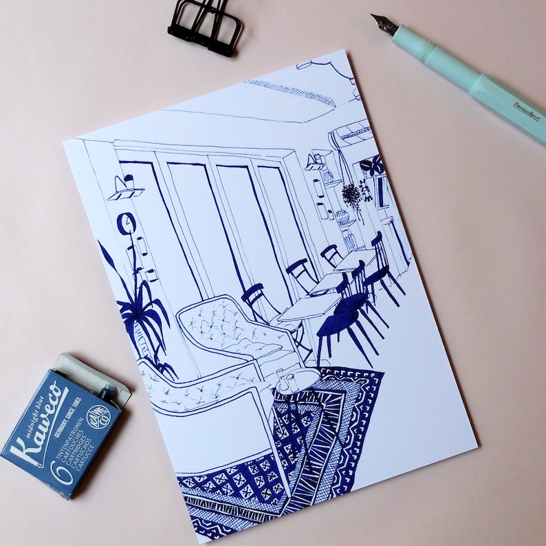 May include: A black and white line drawing of a cafe interior with tables and chairs. The drawing is on a white background and includes a large window with a view of the outside.