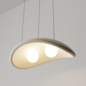 May include: A white, curved, pendant light fixture with two round, white light bulbs.