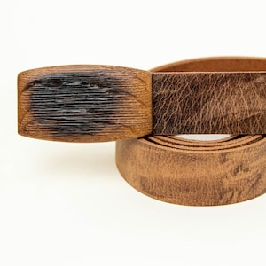 Leather belt with wooden buckle from an antique beer barrel.