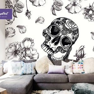 May include: Black and white illustration of a skull with floral details, surrounded by roses and petals on a white background. The image is part of a wall mural.