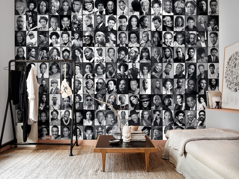 Modern living room decorated with a black and white photo collage mural featuring famous Black icons, creating a striking monochrome accent wall.