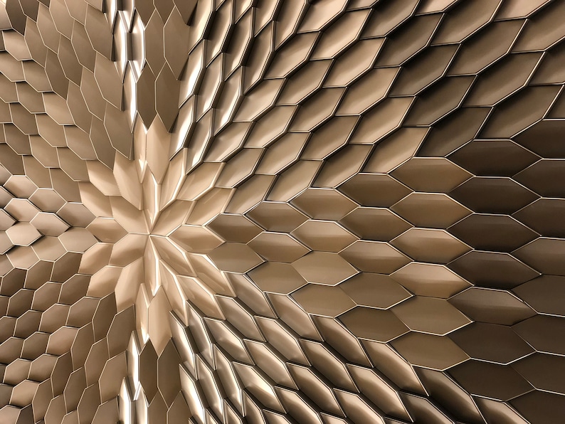 Close-up front view of a single white MABEL 3D wall panel, highlighting its sharp geometric lines and raised polygonal design.