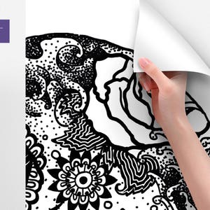 May include: Black and white abstract design with intricate patterns and swirls. The design features a large central flower with a smaller circle in the center. The design is reminiscent of a mandala.